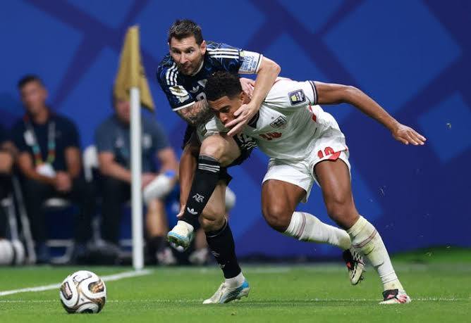 Lionel Messi holds an England player during the 2026 World Cup semi-final