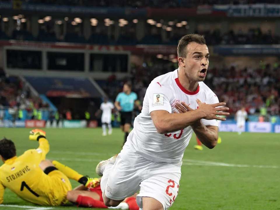 Granit Xhaka makes the double-eagle gesture after scoring for Switzerland against Serbia at the 2018 World Cup